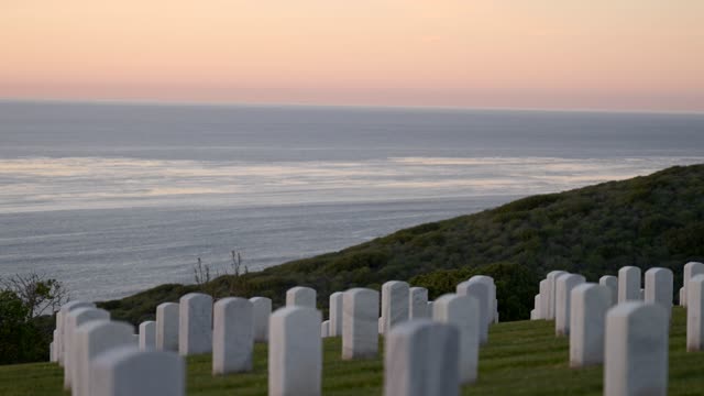 The view of the ocean and headstones at Fort Rosecrans National Cemetery in Point Loma | Video – 11
