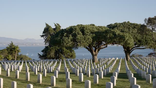 The view of the ocean and headstones at Fort Rosecrans National Cemetery in Point Loma | Video – 7