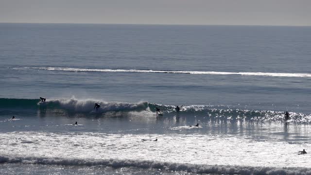 Surfers and the coastline at Grandview Beach in Leucadia Encinitas | Video