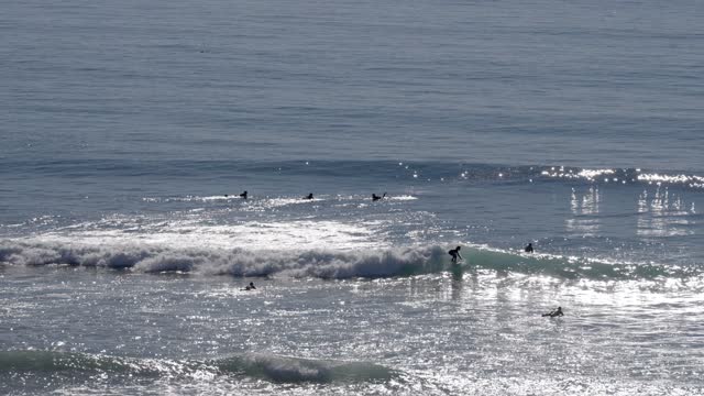 Surfers and the coastline at Grandview Beach in Leucadia Encinitas | Video – 1