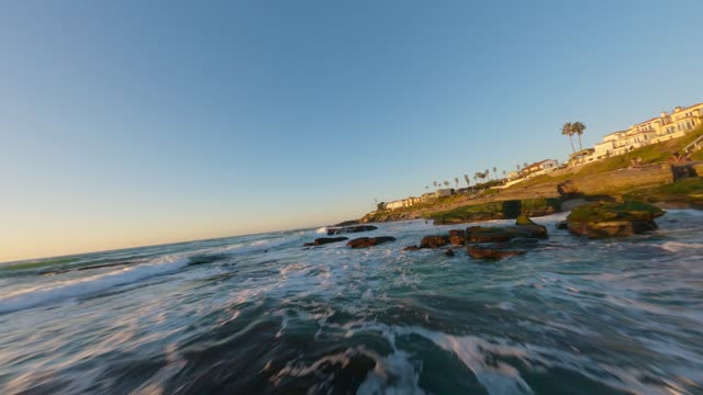 Flying low above the beach and rocks at Windansea in La Jolla | FPV Drone Video