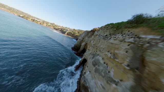 Footage of the Cliffs below Coast Walk Trail at La Jolla Cove | FPV Drone Video – 1