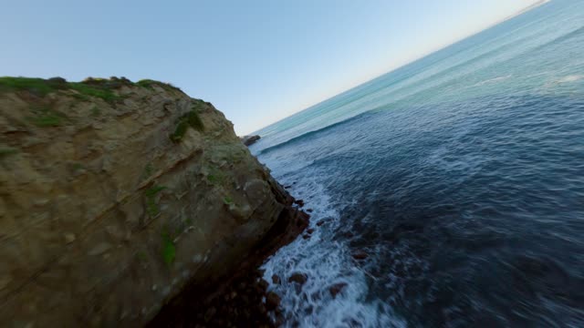 Footage of the Cliffs below Coast Walk Trail at La Jolla Cove | FPV Drone Video – 2