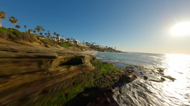 Footage of Children’s Pool Wipeout Beach and Boomer Beach in La Jolla during Sunset | FPV Drone Video