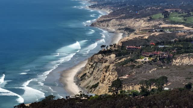 Paragliders flying over La Jolla Shores La Jolla Farms Black’s Beach and Torrey Pines on a beautiful afternoon | Drone Video – 3