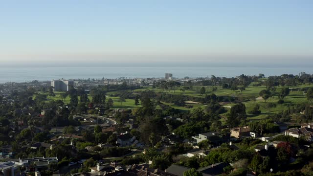 A view from The Muirlands Neighborhood overlooking La Jolla Country Club and the Golf Course | Drone Video