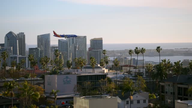 A view of planes landing at San Diego International Airport Lindbergh Field from Bankers Hill Downtown | Video