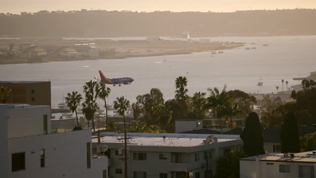 A view of planes landing at San Diego International Airport Lindbergh Field from Bankers Hill Downtown | Video – 11