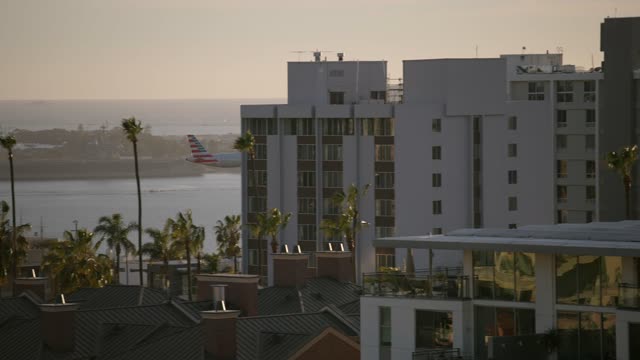 A view of planes landing at San Diego International Airport Lindbergh Field from Bankers Hill Downtown | Video – 9