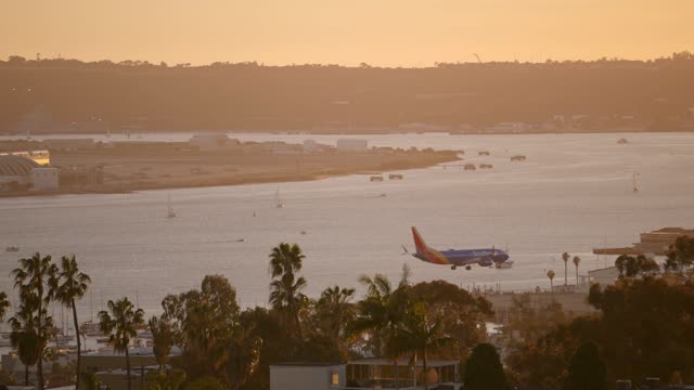 A view of planes landing at San Diego International Airport Lindbergh Field from Bankers Hill Downtown | Video – 14