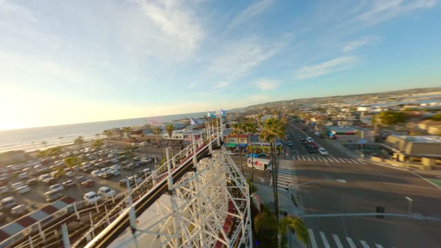 Mission Beach Belmont Park and the Roller coaster during a beautiful San Diego Sunset | FPV Drone Video