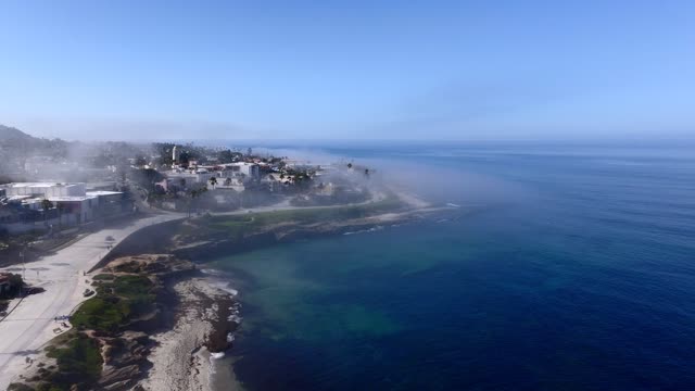 The Fog over Children’s Pool and Wipeout Beach La Jolla Village in San Diego on a beautiful Monring | Drone Video