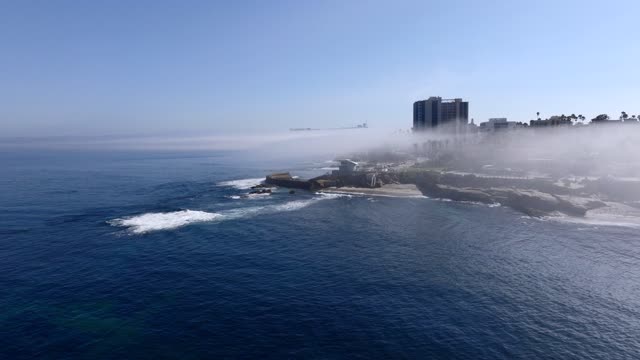The Fog over Children’s Pool and Wipeout Beach La Jolla Village in San Diego on a beautiful Monring | Drone Video – 1