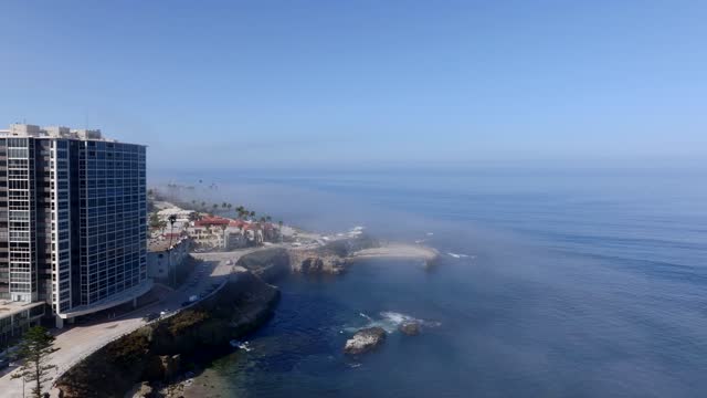 The Fog over Children’s Pool and Wipeout Beach La Jolla Village in San Diego on a beautiful Monring | Drone Video – 3