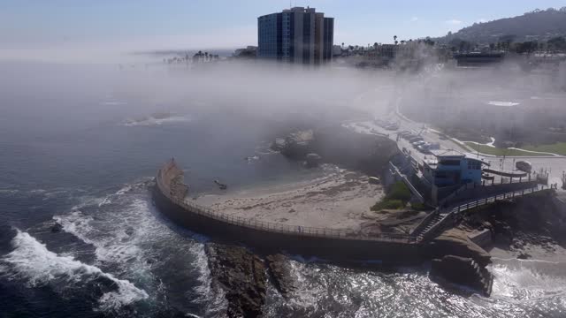 The Fog over Children’s Pool and Wipeout Beach La Jolla Village in San Diego on a beautiful Monring | Drone Video – 8