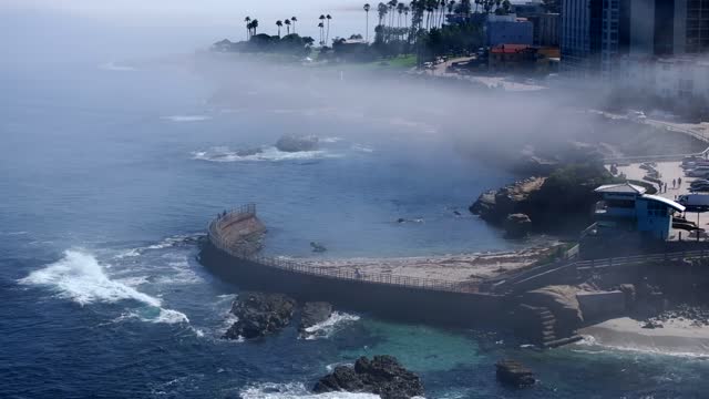 The Fog over Children’s Pool and Wipeout Beach La Jolla Village in San Diego on a beautiful Monring | Drone Video – 7