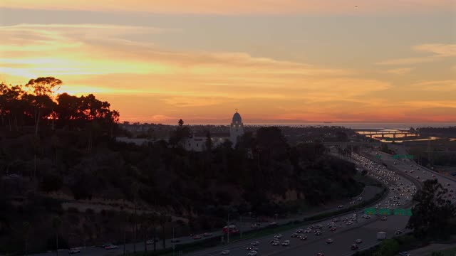The Junipero Serra Museum in Presidio Park in Mission Hills overlooking Mission Valley during Sunset | Drone Video