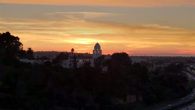 The Junipero Serra Museum in Presidio Park in Mission Hills overlooking Mission Valley during Sunset | Drone Video – 3
