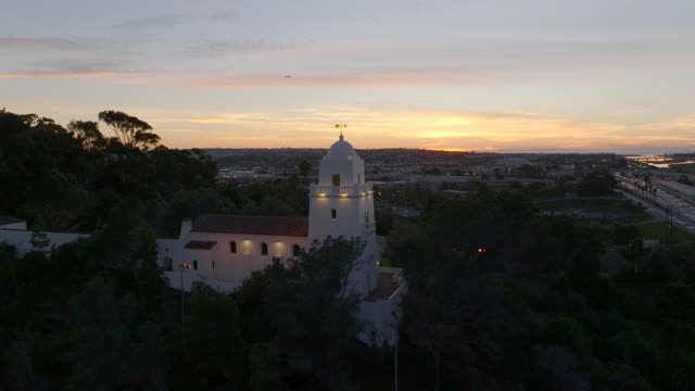 The Junipero Serra Museum in Presidio Park in Mission Hills overlooking Mission Valley during Sunset | Drone Video – 6