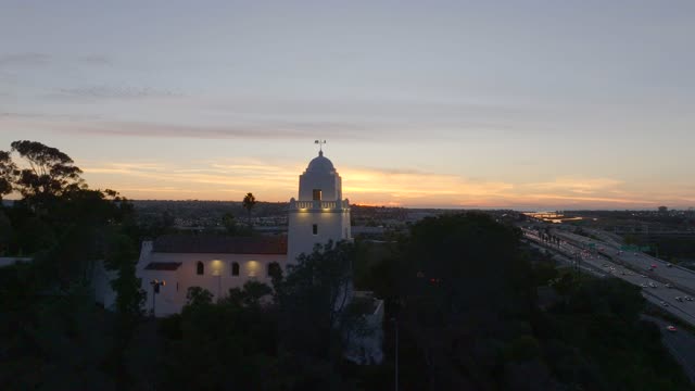 The Junipero Serra Museum in Presidio Park in Mission Hills overlooking Mission Valley during Sunset | Drone Video – 11