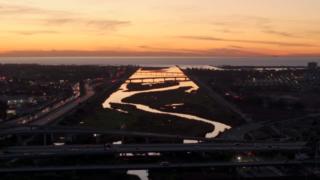 Looking out over the San Diego River towards Mission Beach Mission Bay and Ocean Beach during Sunset | Drone Video – 1
