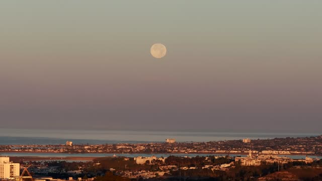 A view of the Full Moon over San Diego Mission Beach Mission Bay and the ocean from North Park | Drone Video – 3