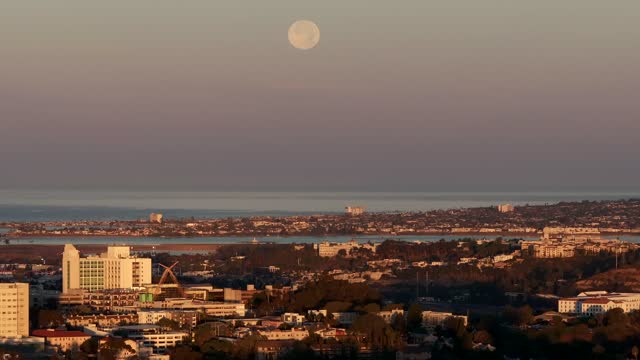 A view of the Full Moon over San Diego Mission Beach Mission Bay and the ocean from North Park | Drone Video – 4