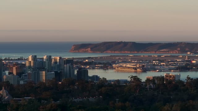 A view of Downtown San Diego and Point Loma from North Park during Sunrise | Drone Video – 2