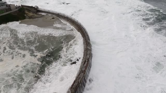 A Stormy and Cloudy day in La Jolla San Diego with big waves at Children’s Pool | Drone Video – 4