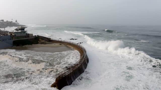 A Stormy and Cloudy day in La Jolla San Diego with big waves at Children’s Pool | Drone Video – 6