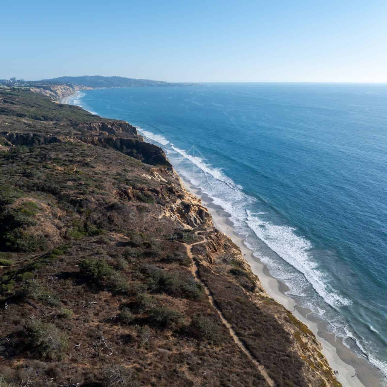 Aerial shot of Torrey Pines State Natural Reserve Beach and La Jolla Coastline on a beautiful day | Drone Photo - 5